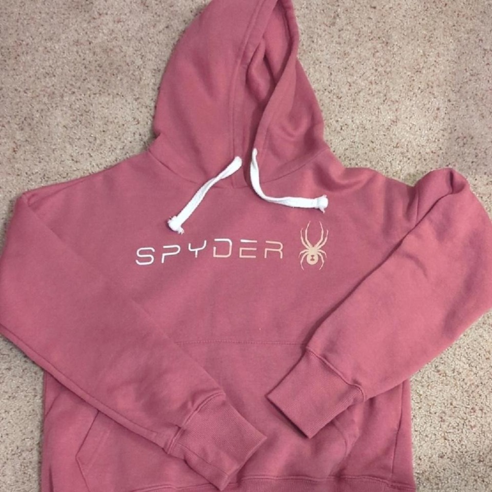 Sporty comfort in the prettiest dusty rose tone. This Spyder pullover hoodie